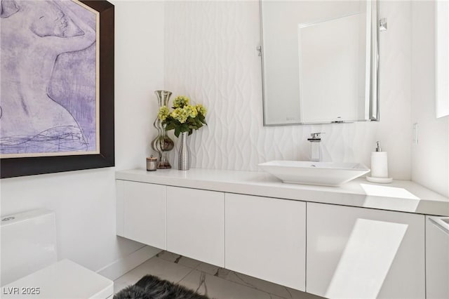 426 Tranquil Peak Ct, Henderson, NV 89012 - bathroom featuring vanity and marble look tiles