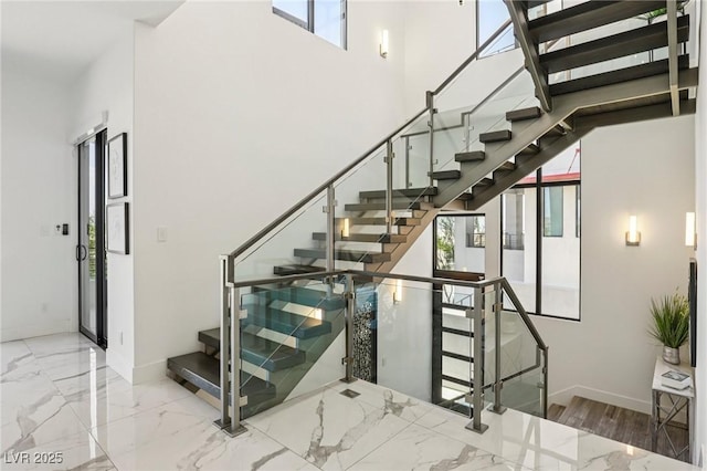 426 Tranquil Peak Ct, Henderson, NV 89012 - stairs with healthy amount of natural light and marble tiled floors