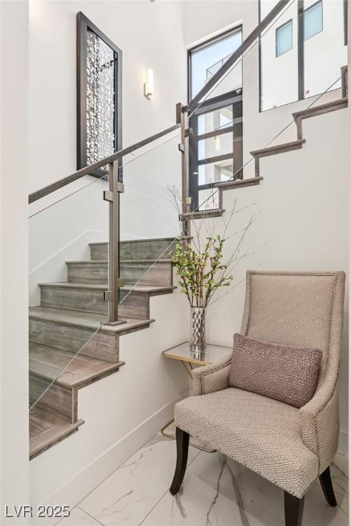 426 Tranquil Peak Ct, Henderson, NV 89012 - stairway with marble look tile flooring and baseboards