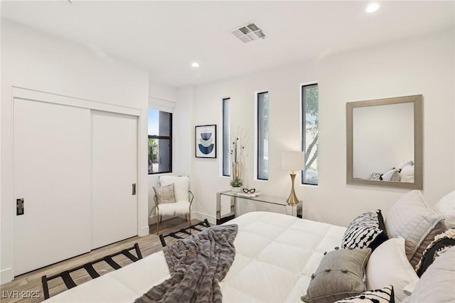426 Tranquil Peak Ct, Henderson, NV 89012 - bedroom with multiple windows, recessed lighting, wood finished floors, and a closet