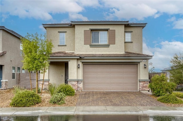 2807 Lindsey Springs St, Las Vegas, NV 89142 - traditional-style house featuring stucco siding, an attached garage, decorative driveway, and stone siding