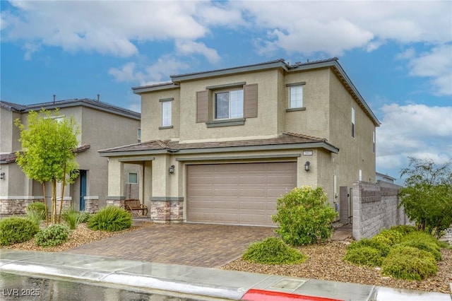 2807 Lindsey Springs St, Las Vegas, NV 89142 - traditional-style house with stucco siding, an attached garage, decorative driveway, and stone siding