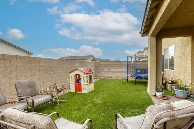 2807 Lindsey Springs St, Las Vegas, NV 89142 - fenced backyard featuring a trampoline