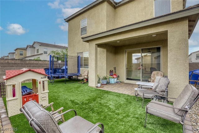 2807 Lindsey Springs St, Las Vegas, NV 89142 - view of yard with a trampoline and a patio area