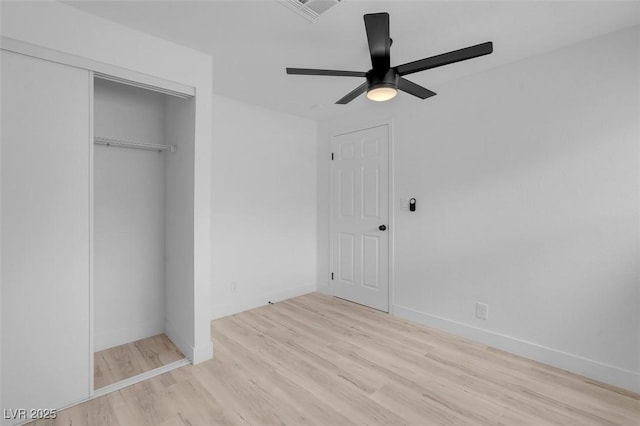 6340 Factor Ave, Las Vegas, NV 89107 - unfurnished bedroom featuring wood finished floors, a closet, and a ceiling fan