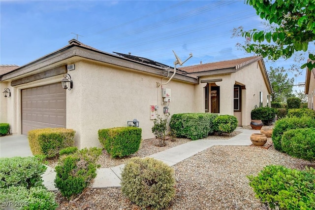4508 Regalo Bello St, Las Vegas, NV 89135 - view of property exterior with stucco siding and a garage