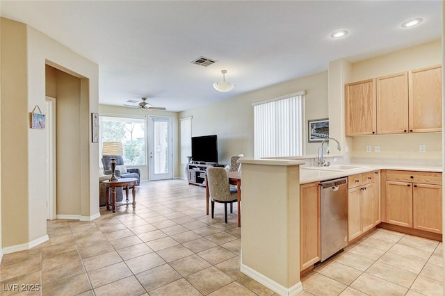 4508 Regalo Bello St, Las Vegas, NV 89135 - kitchen with stainless steel dishwasher, light brown cabinets, open floor plan, a peninsula, and light countertops