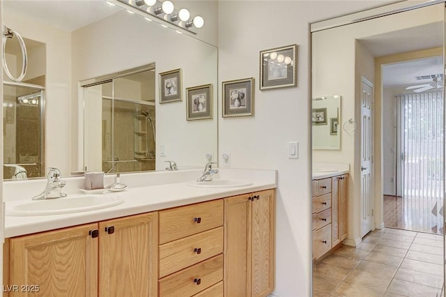 4508 Regalo Bello St, Las Vegas, NV 89135 - bathroom with double vanity, tile patterned flooring, a shower with shower door, and a ceiling fan