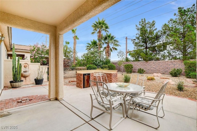 4508 Regalo Bello St, Las Vegas, NV 89135 - fenced backyard featuring outdoor dining space and a patio