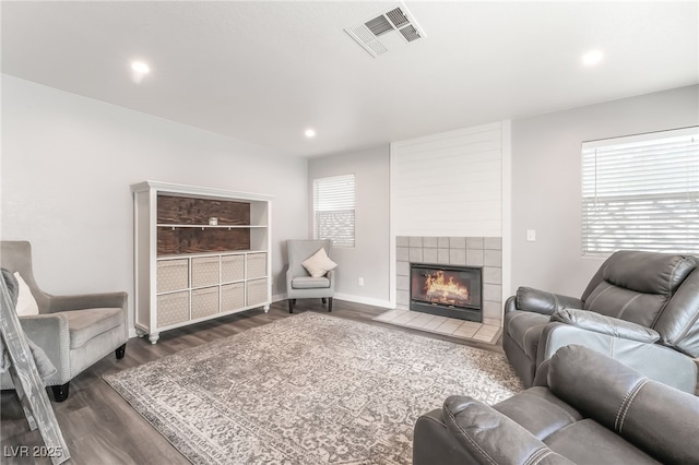 77 Huntfield Dr, Henderson, NV 89074 - living room with wood finished floors, a tile fireplace, and recessed lighting
