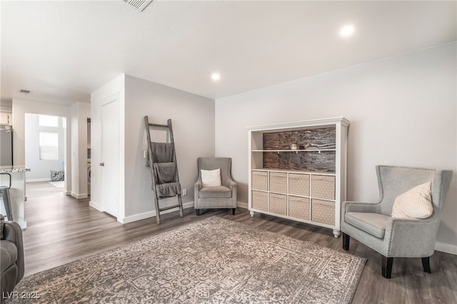 77 Huntfield Dr, Henderson, NV 89074 - sitting room with wood finished floors and recessed lighting