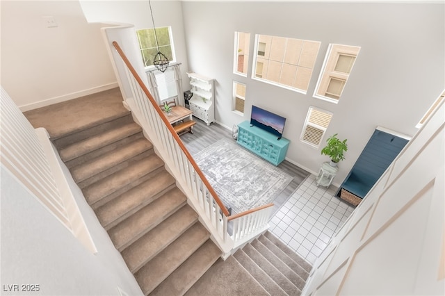 77 Huntfield Dr, Henderson, NV 89074 - stairway with a high ceiling and a chandelier