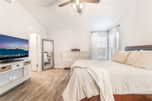 77 Huntfield Dr, Henderson, NV 89074 - bedroom featuring vaulted ceiling, light wood-style floors, and a ceiling fan