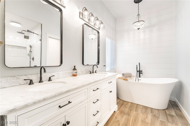 77 Huntfield Dr, Henderson, NV 89074 - full bath with a soaking tub, double vanity, wood finished floors, and a shower