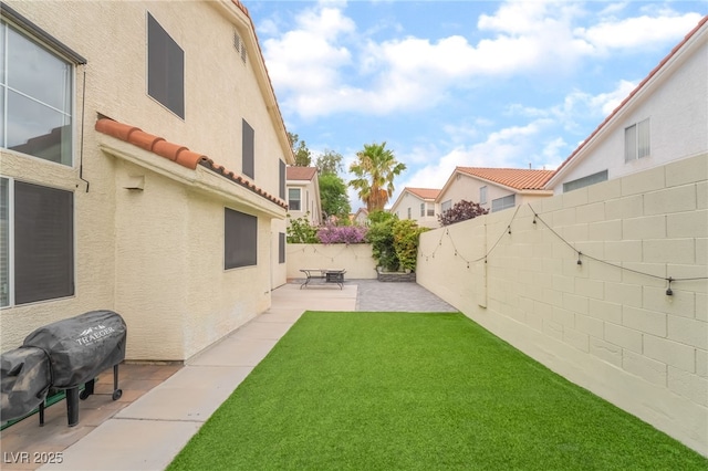 77 Huntfield Dr, Henderson, NV 89074 - fenced backyard featuring a patio area