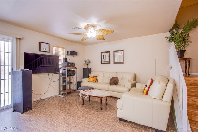5587 Stomping Boots Ave, Las Vegas, NV 89118 - living room with a ceiling fan and plenty of natural light