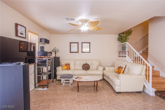5587 Stomping Boots Ave, Las Vegas, NV 89118 - living area with a ceiling fan, stairs, and tile patterned floors