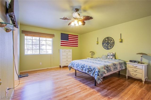 5587 Stomping Boots Ave, Las Vegas, NV 89118 - bedroom featuring light wood finished floors and ceiling fan