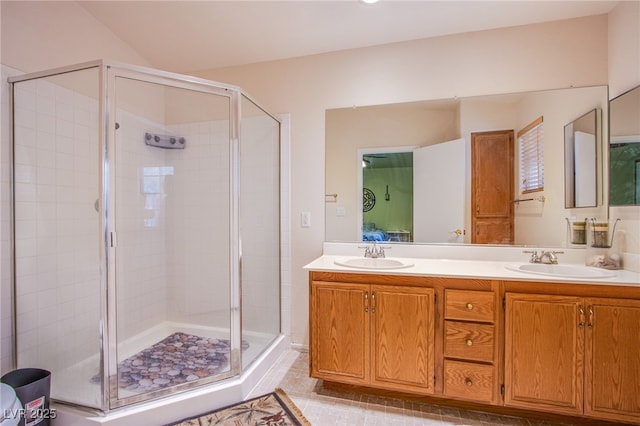 5587 Stomping Boots Ave, Las Vegas, NV 89118 - bathroom with a shower stall, double vanity, and tile patterned floors