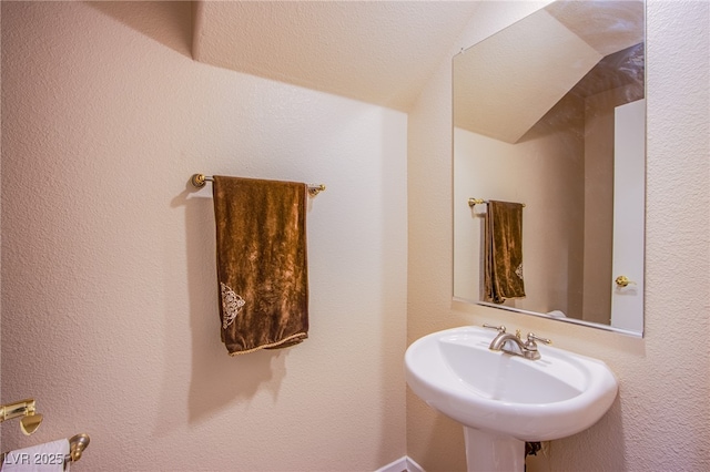 5587 Stomping Boots Ave, Las Vegas, NV 89118 - bathroom with a sink and vaulted ceiling