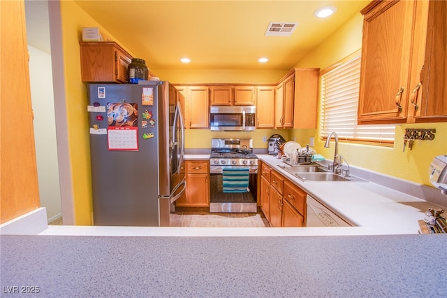 5587 Stomping Boots Ave, Las Vegas, NV 89118 - kitchen featuring appliances with stainless steel finishes, light countertops, and recessed lighting
