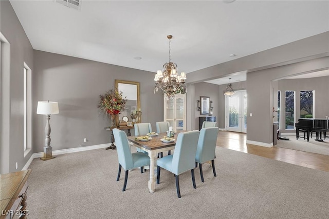 3668 Hillary Elan Ct, Las Vegas, NV 89139 - dining space with carpet and a chandelier