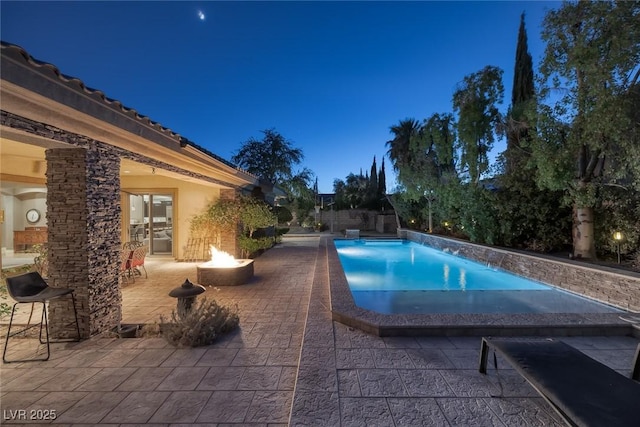 3668 Hillary Elan Ct, Las Vegas, NV 89139 - swimming pool with an outdoor fire pit and a patio area