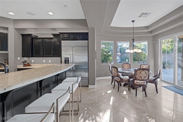 3668 Hillary Elan Ct, Las Vegas, NV 89139 - dining area featuring a chandelier, a raised ceiling, and recessed lighting