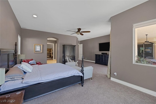 3668 Hillary Elan Ct, Las Vegas, NV 89139 - carpeted bedroom with arched walkways and a ceiling fan