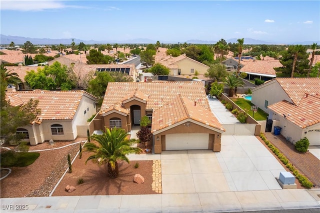 5620 Silver Belle St, Las Vegas, NV 89149 - view of front facade with a residential view, concrete driveway, a tiled roof, and stucco siding