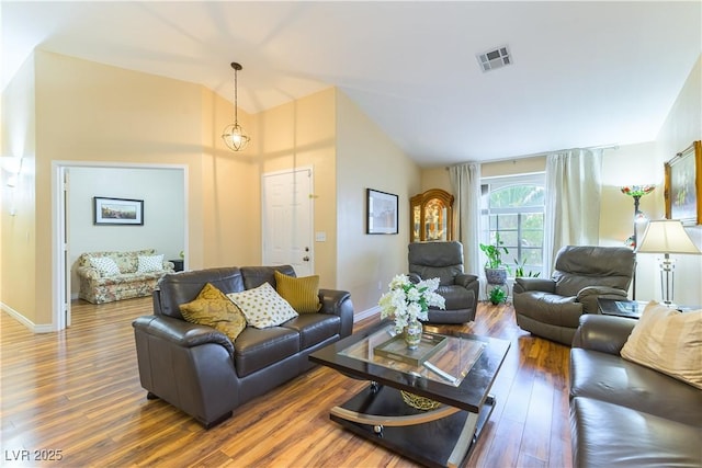 5620 Silver Belle St, Las Vegas, NV 89149 - living room featuring vaulted ceiling and wood finished floors