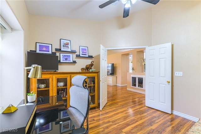 5620 Silver Belle St, Las Vegas, NV 89149 - home office with wood finished floors and ceiling fan