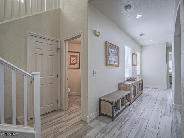 7375 Emerald Glow St, Las Vegas, NV 89123 - hallway featuring light wood finished floors, recessed lighting, and stairs