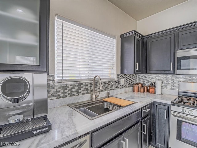 7375 Emerald Glow St, Las Vegas, NV 89123 - kitchen with appliances with stainless steel finishes, backsplash, and light countertops