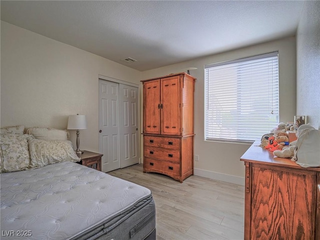 7375 Emerald Glow St, Las Vegas, NV 89123 - bedroom featuring light wood-style floors and a closet