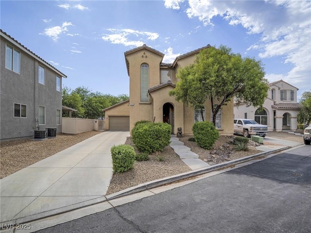 7375 Emerald Glow St, Las Vegas, NV 89123 - mediterranean / spanish-style house with stucco siding, concrete driveway, and a garage