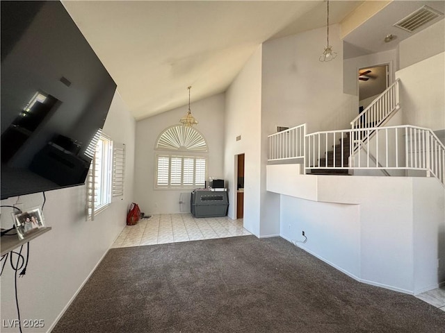 6492 Silent Pine Ave, Las Vegas, NV 89156 - unfurnished living room with stairs, high vaulted ceiling, and carpet floors
