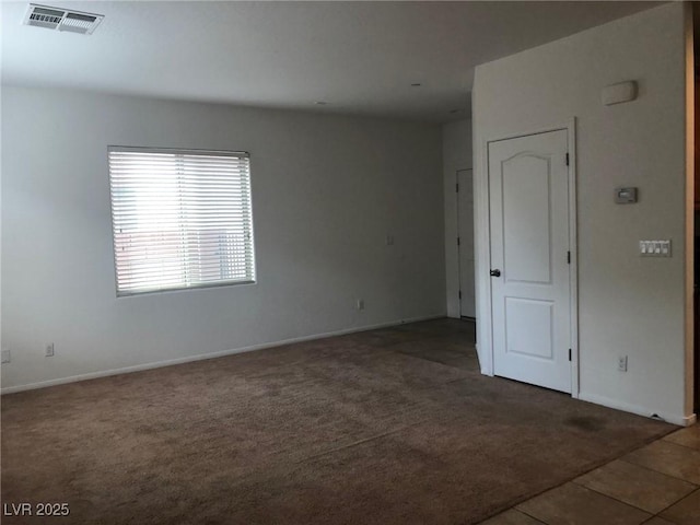 714 Calamus Palm Pl, Henderson, NV 89011 - carpeted spare room with baseboards and tile patterned floors