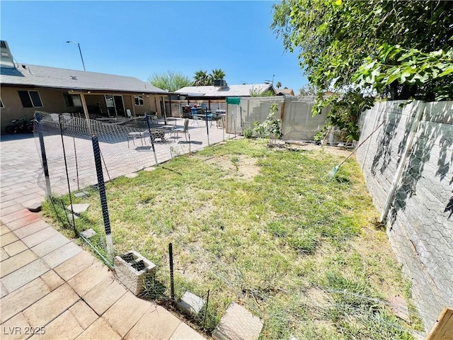 4109 Studio St, Las Vegas, NV 89115 - fenced backyard with a patio