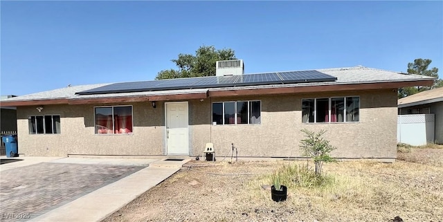 4109 Studio St, Las Vegas, NV 89115 - view of front of home featuring solar panels and stucco siding