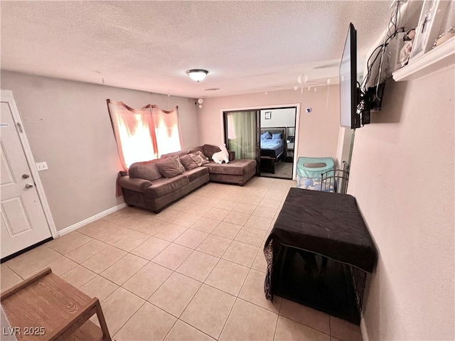 4109 Studio St, Las Vegas, NV 89115 - living room with light tile patterned flooring and a textured ceiling
