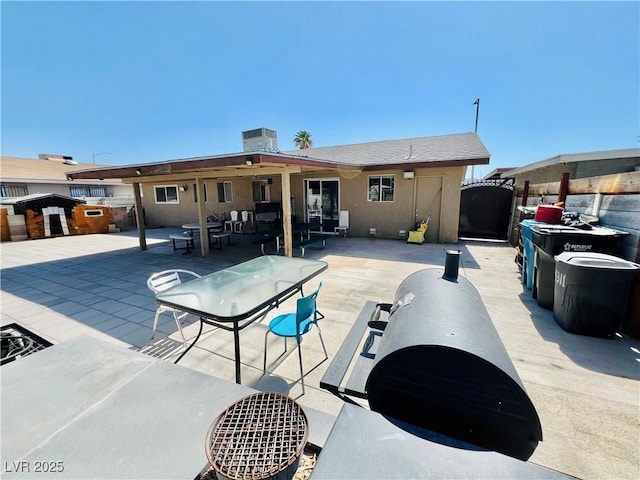 4109 Studio St, Las Vegas, NV 89115 - rear view of house featuring a patio area, a gate, and stucco siding