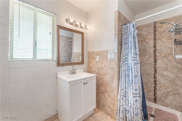 4436 E Ogden Ave, Las Vegas, NV 89110 - full bathroom featuring tile walls, tiled shower, and vanity