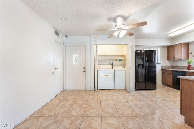 4436 E Ogden Ave, Las Vegas, NV 89110 - kitchen featuring black appliances, ceiling fan, a textured ceiling, brown cabinetry, and washing machine and dryer