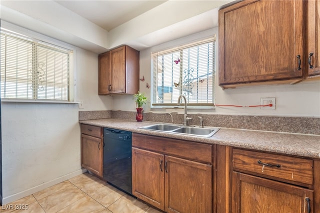 4436 E Ogden Ave, Las Vegas, NV 89110 - kitchen with black dishwasher, light tile patterned floors, and brown cabinetry