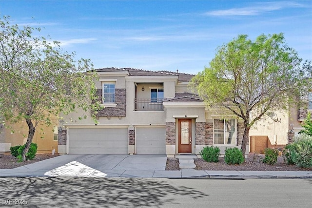 609 Doubleshot Ln, Henderson, NV 89052 - prairie-style house featuring stucco siding, concrete driveway, an attached garage, a balcony, and a tile roof