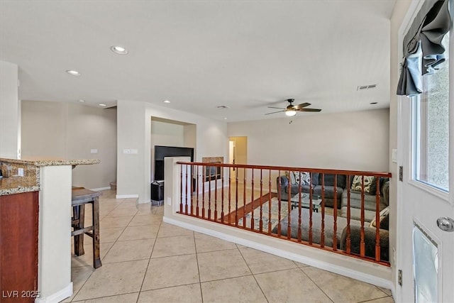 609 Doubleshot Ln, Henderson, NV 89052 - hall with an upstairs landing, recessed lighting, and light tile patterned floors