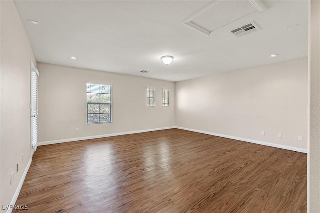 609 Doubleshot Ln, Henderson, NV 89052 - unfurnished room with wood finished floors, attic access, and recessed lighting
