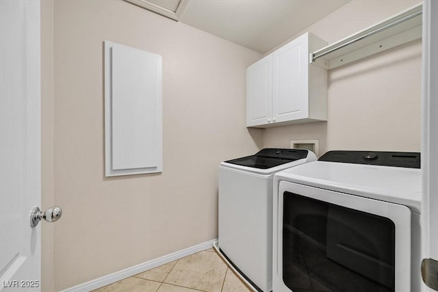 609 Doubleshot Ln, Henderson, NV 89052 - laundry area with independent washer and dryer, cabinet space, and light tile patterned flooring