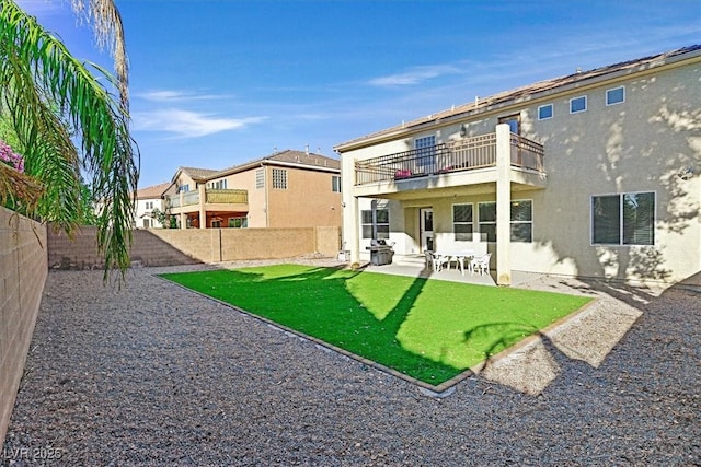 609 Doubleshot Ln, Henderson, NV 89052 - rear view of property with a balcony, a fenced backyard, a patio, and stucco siding